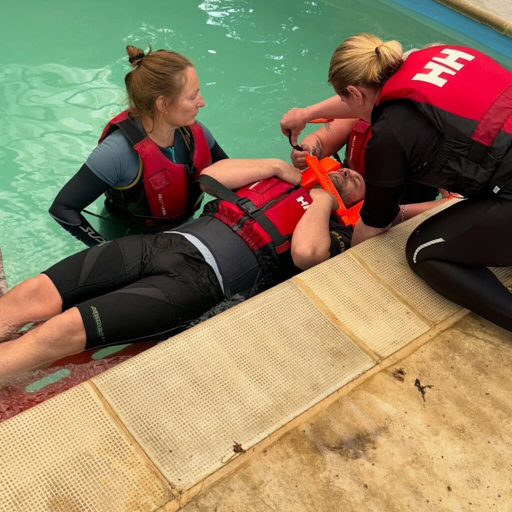 People under taking water safety training in a pool